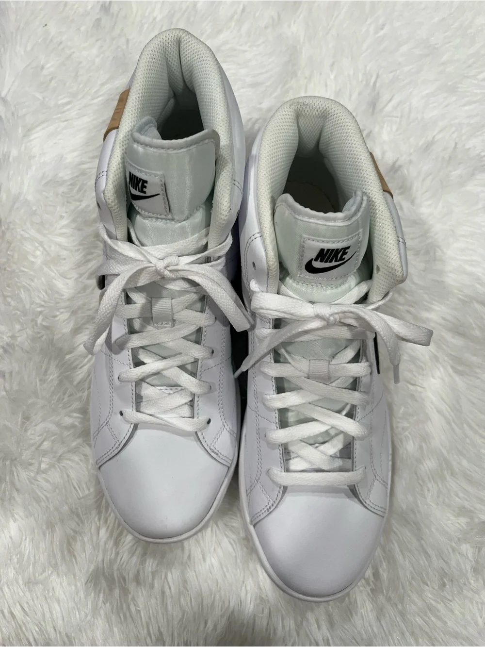 Nike White High-Top Sneakers with Black Swoosh and Tan Heel Tab